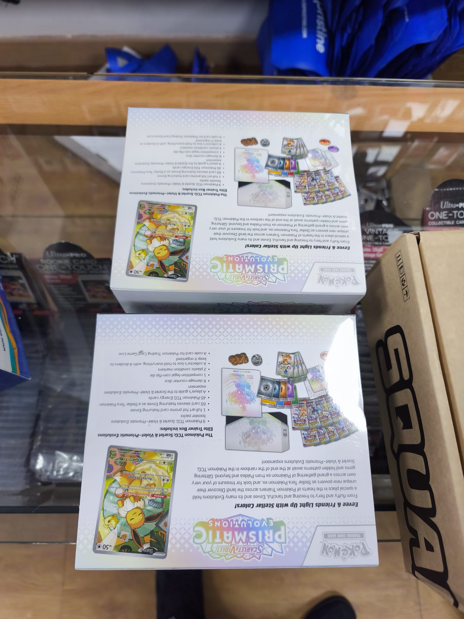 Caja Cromos Pokémon Prismatic Evolutions ETB Ingles